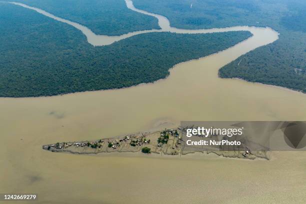 An aerial view of coastal area which is isolated because of the climate change. Due to climate change, again rising tides collapsing the embankments...