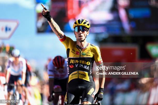 Team Jumbo's Slovenian rider Primoz Roglic celebrates as he crosses the finish line in first place during the 4th stage of the 2022 La Vuelta cycling...