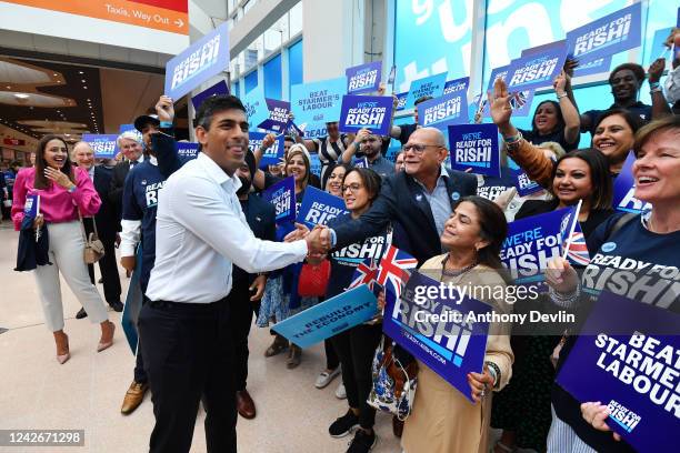 Former Chancellor to the Exchequer and Conservative leadership hopeful Rishi Sunak is greeted by supporters ahead of the Conservative leadership...
