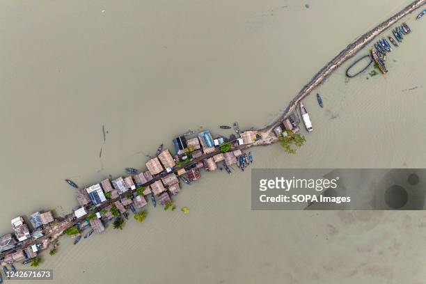 Aerial view of Kalabogi village during the high tide in Khulna. Not too long ago Kalabogi, a coastal village in Bangladesh, was full of cultivable...