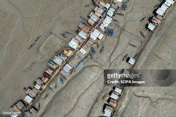Aerial view of Kalabogi village during the low tide in Khulna. Not too long ago Kalabogi, a coastal village in Bangladesh, was full of cultivable...