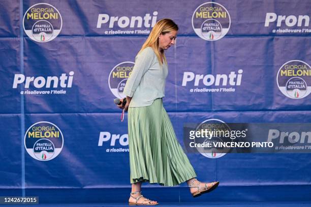 Leader of Italian far-right party Fratelli d'Italia Giorgia Meloni arrives to address supporters during a rally to launch her campaign for general...