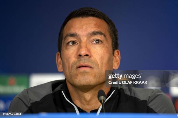 Rangers FC's head coach Giovanni van Bronckhorst addresses the press in Eindhoven, on August 23 on the eve of the Champions League play-off football...