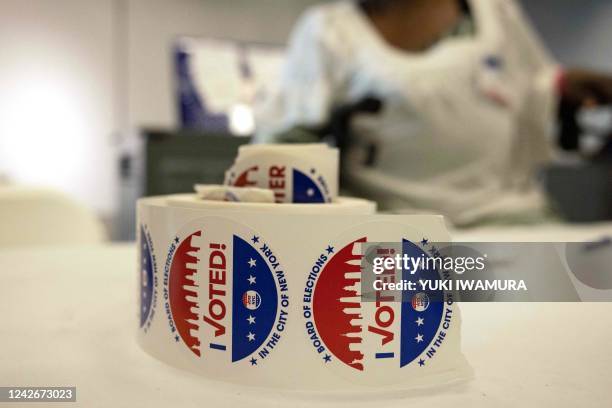 Voting stickers sit on a a table during Primary Election Day on August 23, 2022 in New York. - The US special election is being viewed as the last...