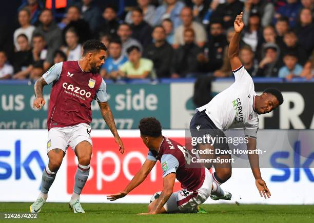 Bolton Wanderers' Oladapo Afolayan is tackled by Aston Villa's Boubacar Kamara during the Carabao Cup Second Round match between Bolton Wanderers and...