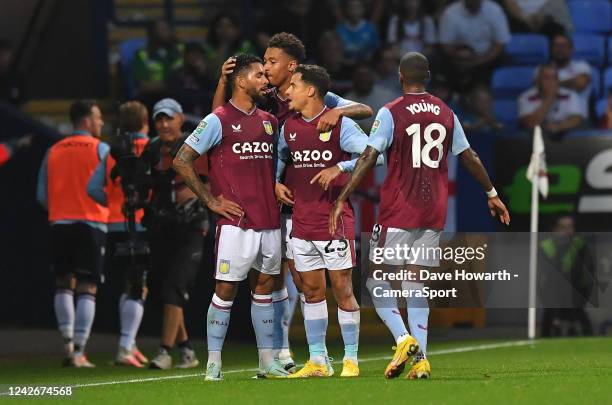 Aston Villa's Douglas Luiz is congratulated on scoring his sides 1st goal during the Carabao Cup Second Round match between Bolton Wanderers and...