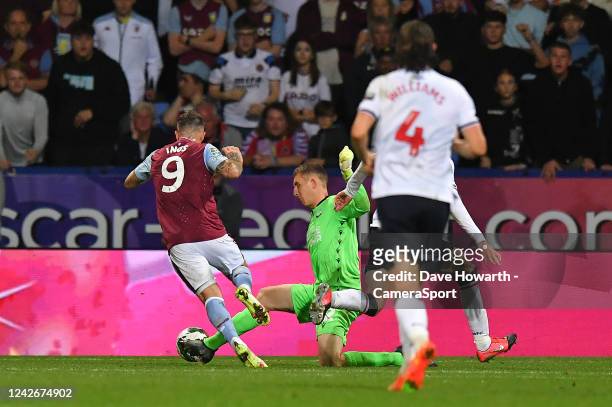Bolton Wanderers' Joel Dixon fouls Aston Villa's Danny Ings to give away a penalty during the Carabao Cup Second Round match between Bolton Wanderers...
