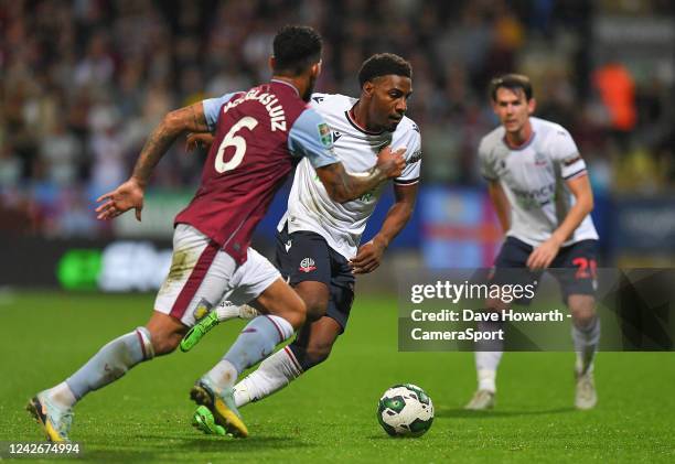 Bolton Wanderers' Oladapo Afolayan battles with Aston Villa's Douglas Luiz during the Carabao Cup Second Round match between Bolton Wanderers and...