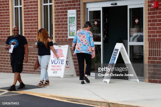 Hillsborough County enter their polling place to cast their ballots on primary election day on August 23, 2022 in Tampa, Florida. Florida voters will...