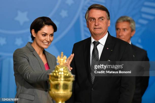 Jair Bolsonaro President of Brazil and First Lady Michelle Bolsonaro take part in a welcome ceremony of the urn with the heart of Portuguese monarch...
