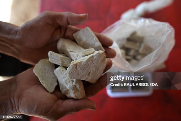 Man holds coca paste, a crude extract of the coca leaf, in Catatumbo, Norte de Santander Department, Colombia, on August 20, 2022. - The Catatumbo...
