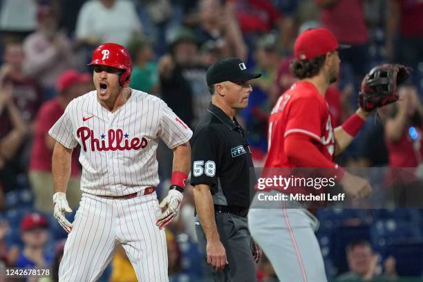 Realmuto of the Philadelphia Phillies reacts after hitting a two-RBI triple in the bottom of the sixth inning against the Cincinnati Reds at Citizens...