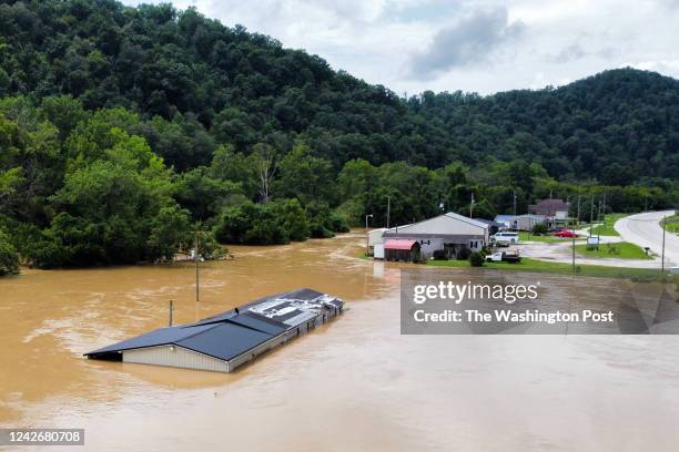 Homes along KY-15 is almost completely submerged in water from the North Fork of the Kentucky River.