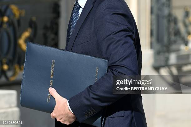 France's Labour Minister Olivier Dussopt arrives to attend the weekly cabinet meeting at the presidential Elysee Palace in Paris on August 24, 2022....