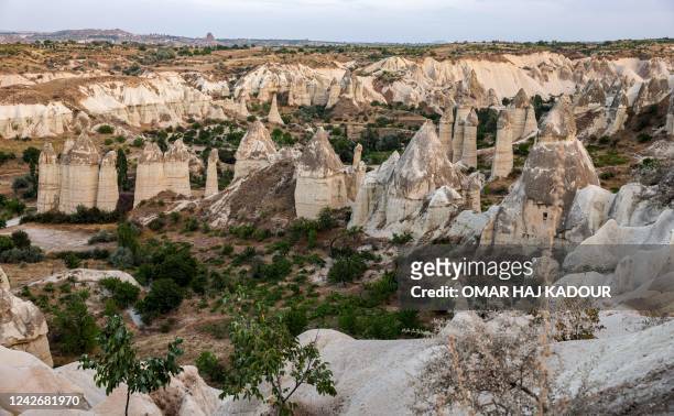 This picture taken on August 23, 2022 shows a view of the cave dwellings at Goreme Historical National Park, east of Nevesehir in the province of the...