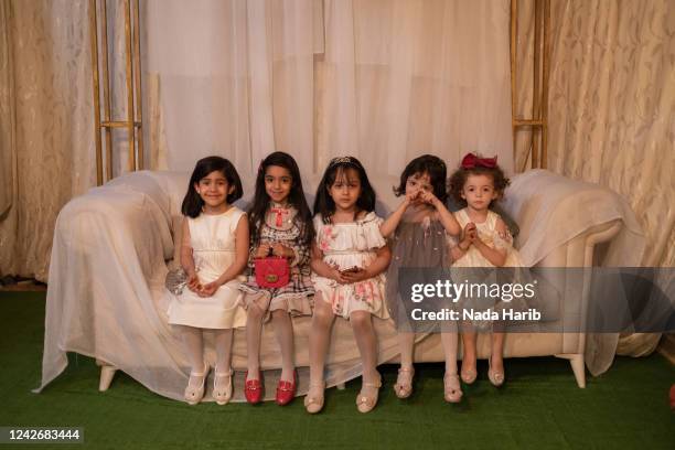 Girls that related to Mahmoud Al-Delieh, a mine survivor, pose for a photo in his wedding day in Khallat Al-Forjan on May 15, 2022 Tripoli, Libya....