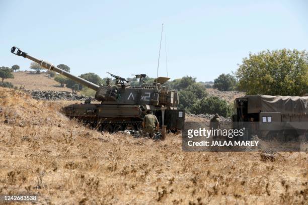 An Israeli army M109 155mm self-propelled howitzer deploys towards the Israel-Lebanon border in the Israeli-annexed Golan Heights on August 24, 2022....