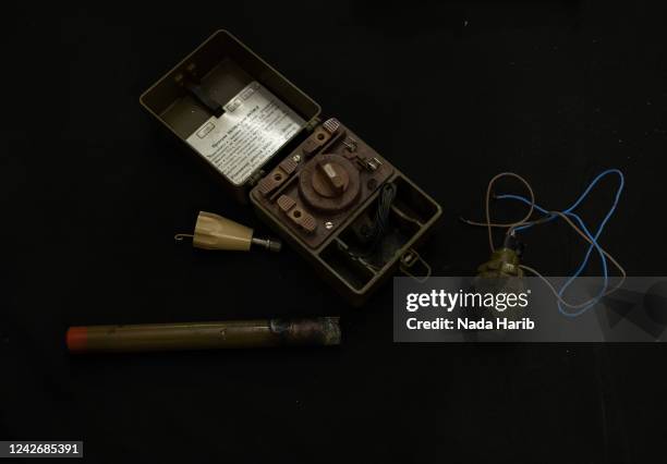 Set of ammunition, pomegranate and a mine warning sign, is seen at a demining groups headquarters in Hay al-Andalus on March 27, 2022 Tripoli, Libya....