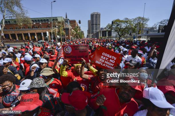 Demonstrators march during a national strike day of action over the high cost of living, organised by the Congress of South African Trade Unions , in...