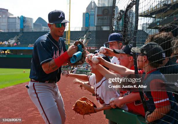 Vaughn Grissom of the Atlanta Braves high fives fans before the game against the Pittsburgh Pirates at PNC Park on August 24, 2022 in Pittsburgh,...