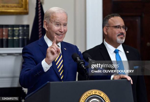President Joe Biden announces student loan relief with Education Secretary Miguel Cardona on August 24, 2022 in the Roosevelt Room of the White House...