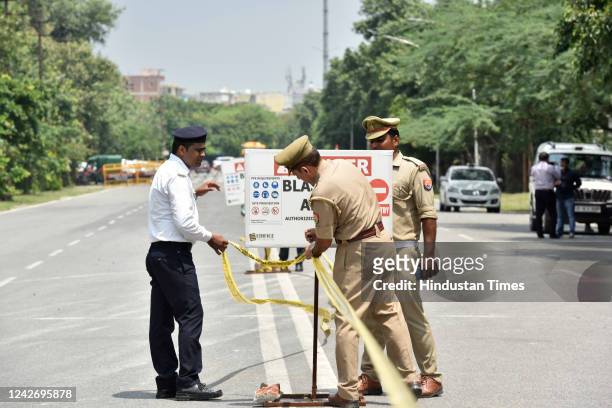 Police personnel deployed near Supertech Twin Tower demolition site on August 24, 2022 in Noida, India. The rigging of both the illegal towers of...