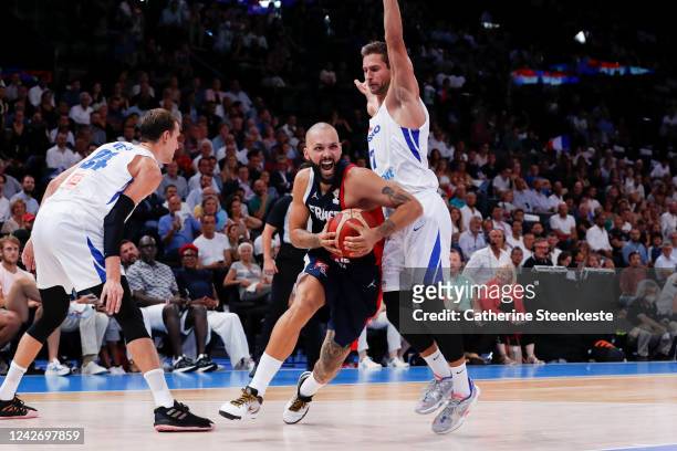 Evan Fournier of France dribbles the ball against Tomas Kyzlink of Czech Republic and Jan Vesely of Czech Republic during the FIBA Basketball World...