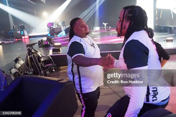 Dimez of Bucks Gaming high fives Cooks during the 2022 NBA 2K League 5v5 Playoffs on August 24, 2022 at NBA 2K League Studio in Indianapolis,...