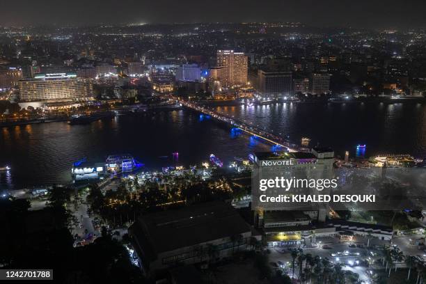 This picture taken on August 24, 2022 from the landmark Cairo Tower shows a night-time view of the Kasr al-Nile bridge connecting Tahrir Square in...