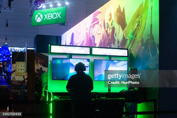 Visitors are see playing at Xbox booth at Messe cologne, Germany on August 24, 2022 during the Gamescom 2022 press preview opening day