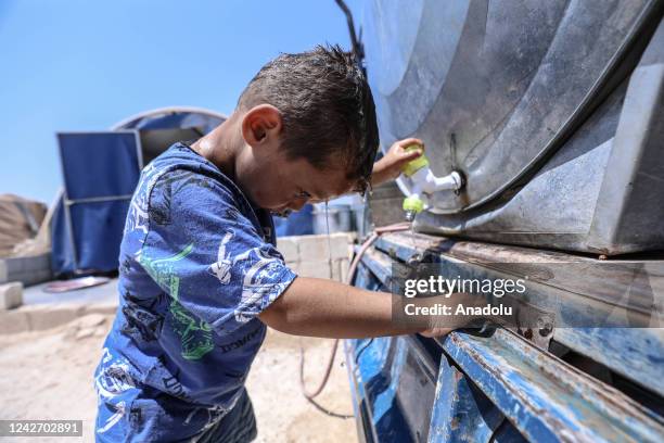 Syrian children, who took shelter in the camp after escaping the attacks of the Bashar al-Assad regime, is seen at a refugee camp in Idlib, Syria on...