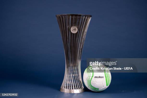 View of the UEFA Europa Conference League 2022/23 Group Stage match ball next to the UEFA Europa Conference League trophy during the UEFA Club...