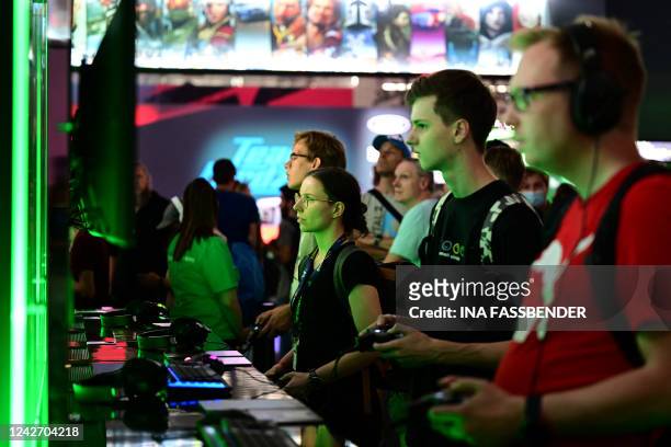 Photo shows visitors playing the game Sea of Thieves of the Xbox booth at the Gamescom video game fair in Cologne on August 24, 2022. According to...