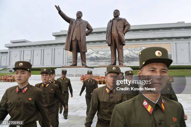 North Korean soldiers visit Mansu Hill in Pyongyang to offer flowers on Aug. 25 the 62nd anniversary of the beginning of former leader Kim Jong Il's...