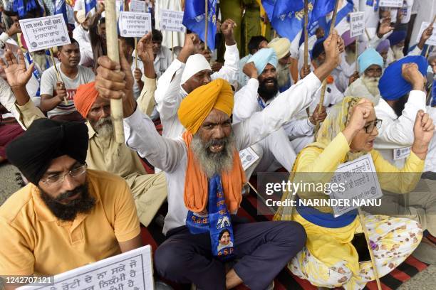 Workers of India's Bahujan Samaj Party shout slogans during a demonstration in Amritsar on August 25 against the death of Indra Meghwal, a student...