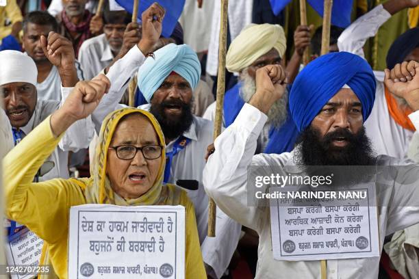 Workers of India's Bahujan Samaj Party shout slogans during a demonstration in Amritsar on August 25 against the death of Indra Meghwal, a student...