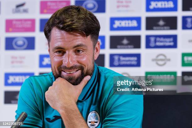 Manager Russell Martin speaks to members of the press during the Swansea City AFC Press Conference at the Swansea.com Stadium on August 25, 2022 in...