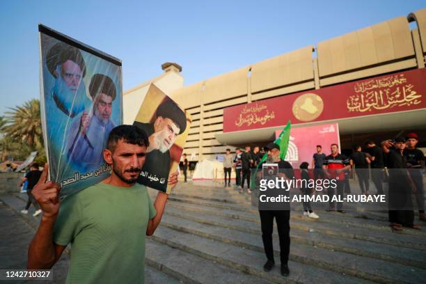 Supporters of Iraqi Shiite cleric Moqtada al-Sadr gather during a protest against the nomination of a rival Shiite faction for the position of prime...