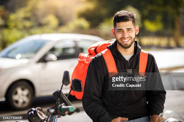 delivery guy portrait - motoboy - motoboy stock pictures, royalty-free photos & images