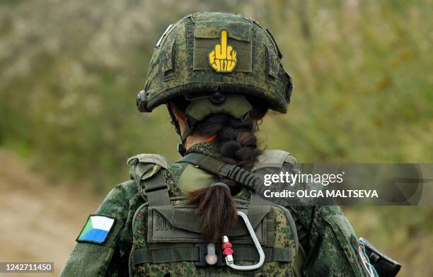 Female officer of the Russian Defence Ministry attends the All-Russian competition "Alive forever" in shooting from military weapons among the best...