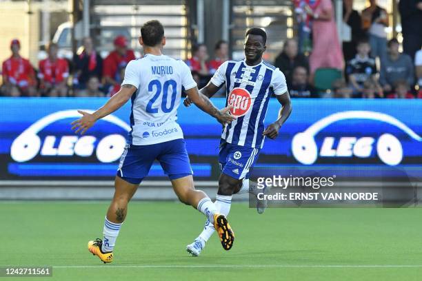 Helsinki's Ghanaian forward Malik Abubakari celebrates scoring the opening goal with his Brazialian teammate Murilo during the UEFA Europa League...