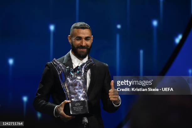 Men's Player of the Year Karim Benzema poses with their award on stage during the UEFA Champions League 2022/23 Group Stage Draw at Halic Congress...