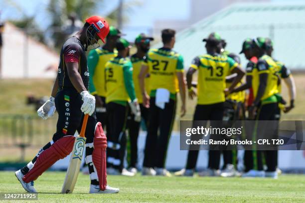 Evin Lewis of St Kitts & Nevis Patriots walks off the field dismissed by Migael Pretorius of Jamaica Tallawahs during the 2022 Hero Caribbean Premier...