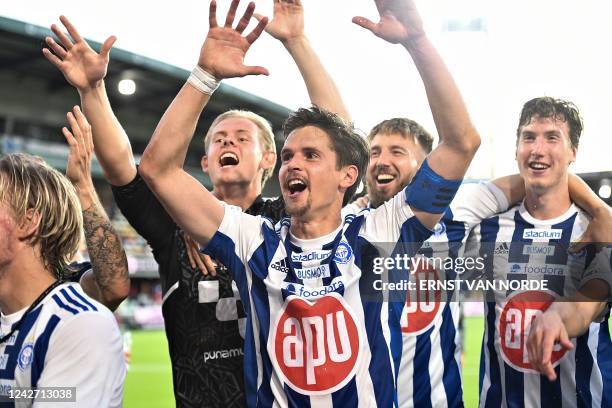 Helsinki's players including Jukka Raitala celebrate after the UEFA Europa League second leg play-off football match Silkeborg IF v HJK Helsinki in...