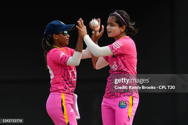 Fatima Sana and Mandy Mangru of Barbados Royals celebrate the dismissal of Lee Ann Kirby of Trinbago Knight Riders during the 2022 Hero Caribbean...