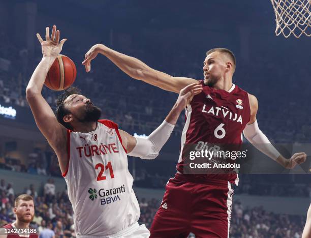 Sertac Sanli of Turkiye in action against Kristaps Porzingis of Latvia during the FIBA Basketball World Cup 2023 European Qualifiers second round...