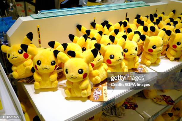 Pokemon's "Pikachu" stuffed toys are seen at a shop in Tokyo. The Pokemon Go Plus wearable accessory completely sold out online and at the company's...