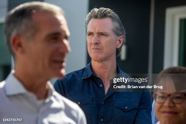 Los Angeles, CA - August 24 Gov. Gavin Newsom, center, is flanked by LA mayoral candidate Karen Bass, right, and Mayor Eric Garcetti, left, as he...