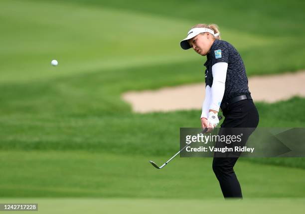 Brooke Henderson of Canada chips onto the 18th green during the first round of the CP Women's Open at Ottawa Hunt and Golf Club on August 25, 2022 in...
