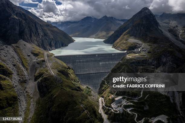 This general view shows the 285 meter high Grande Dixence dam above Heremence, western Switzerland, on August 22, 2022. - Switzerland is among the...